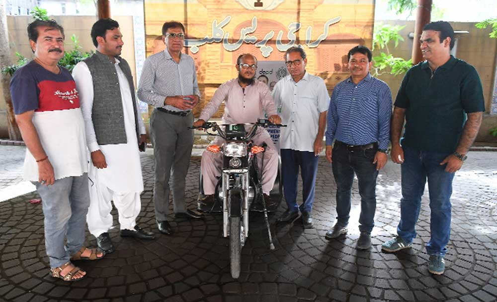 DEPD, PEDF present three-wheeled motorcycle to Karachi Press Club employee DEPD, PEDF present three-wheeled motorcycle to Karachi Press Club employee