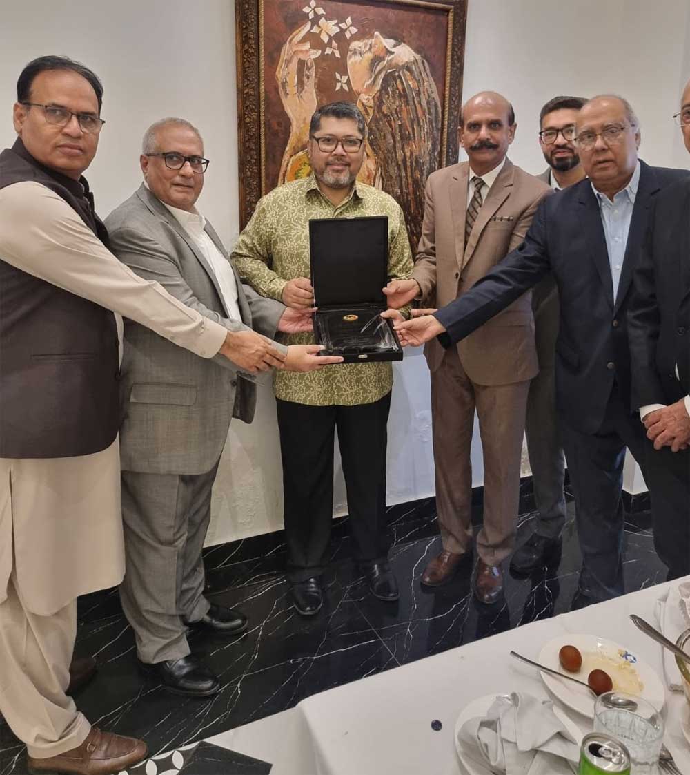Mr. Shahid Jawed Qureshi Presenting PMFA Memento Mr. Shahid Jawed Qureshi Presenting PMFA Memento